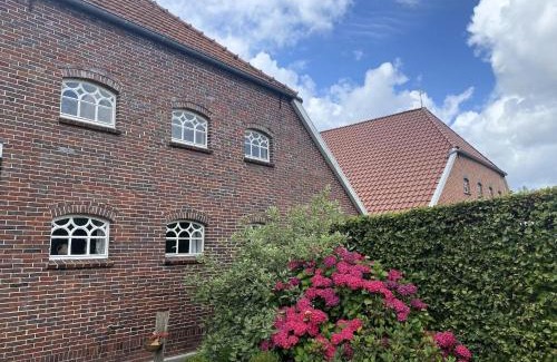 Strackholt Apartment | Reihenhaus in Strackholt mit beheiztem Pool