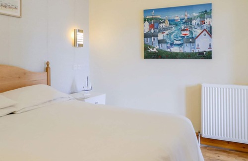 Portpatrick Cottage | Relax and watch the buzz of the harbour from your living room window.