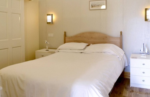 Portpatrick Cottage | Relax and watch the buzz of the harbour from your living room window.