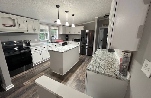 Bracey House | Relax at this Golf Community House with nearby water access!