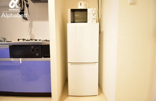 Kita Ward Apartment | Relax in a calm space A room with a kitchen where - Alphabed Okayama Sennichimae 105 /Okayama Okayama
