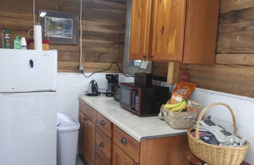 Murphy RV Rental | Relax in a Safari Glamp Tent beside the creek, firepit- outdoor experience.