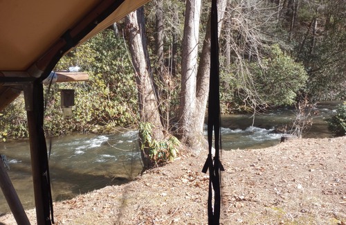 Murphy RV Rental | Relax in a Safari Glamp Tent beside the creek, firepit- outdoor experience.