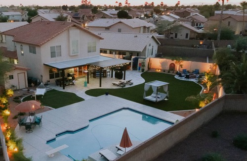 Avondale House | Relax in private heated hot tub or just bask in the sun by the pool.