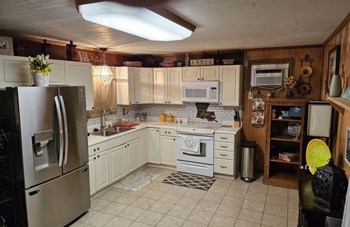 Sulphur Apartment | Relax in the pool with cool beverage or on the balcony with a glass of wine.