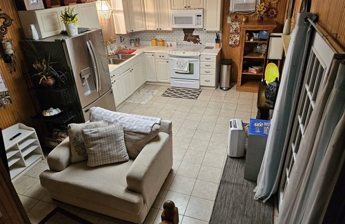 Sulphur Apartment | Relax in the pool with cool beverage or on the balcony with a glass of wine.