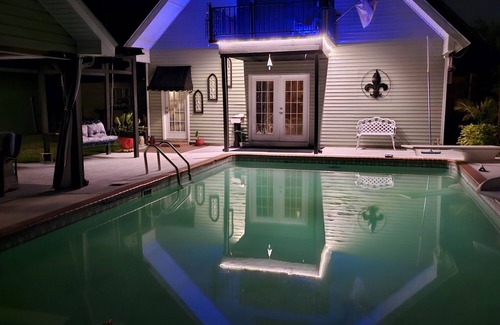 Sulphur Apartment | Relax in the pool with cool beverage or on the balcony with a glass of wine.