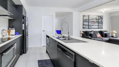 Bongaree House | Relax Poolside By The Canal
