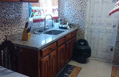 Spanish Town Zone House | Relax & Recharge in Spanish Town – 2BR Oasis w/Hot Tub, AC & Wi-Fi