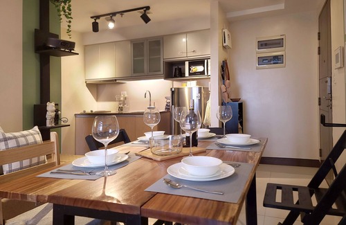 Bonifacio Global City Condo | Relax to a family size condo with fun games, popcorn and cinematic movie.