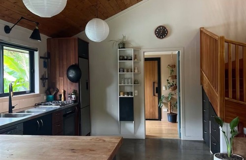 Raglan House | Relax & Unwind at Wainui Creek Retreat a private & tranquil home by the beach