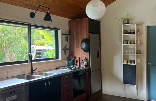 Raglan House | Relax & Unwind at Wainui Creek Retreat a private & tranquil home by the beach