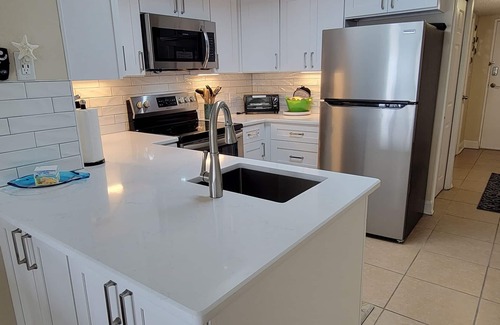Jacksonville Beach Condo | REMODELED 2/2 Direct Oceanfront 3rd floor end-unit w elevator and wrap balcony