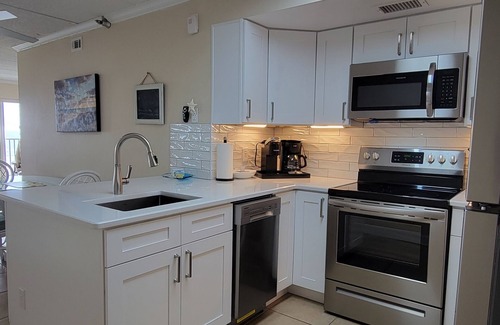 Jacksonville Beach Condo | REMODELED 2/2 Direct Oceanfront 3rd floor end-unit w elevator and wrap balcony
