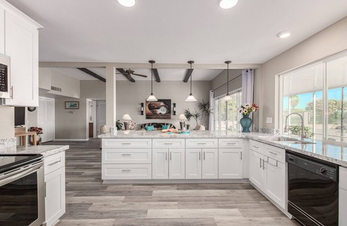Sun City House | Remodeled designers home with sunrises and sunset views on Palm Brook Golf !