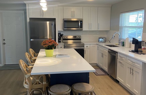 Yacht Club House | Remodeled gulf access home with amazing views and private cage enclosed pool.