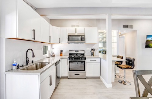 North Las Vegas House | Remodeled Home with Lush Landscapes, King Beds, BBQ, Games, Workspace and More!