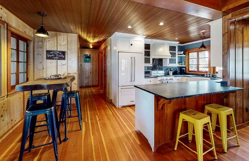 Bass Lake Cabin | Remodeled lake-view home with private dock, fireplace, outdoor shower, deck, AC