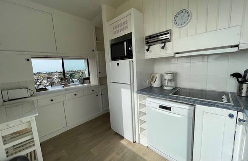Jullouville Apartment | Renovated apartment with private tennis, parking and sea view