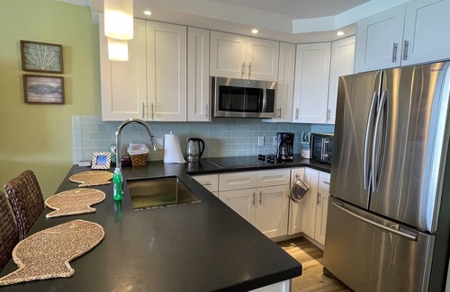 Red Hook Condo | Renovated Beachfront Penthouse on Sapphire Beach with washing machine and dryer.