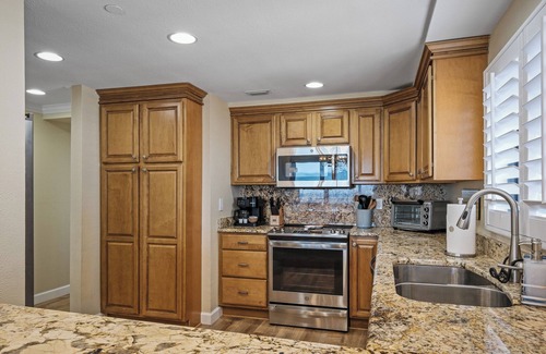 New Smyrna Beach Condo | Renovated direct oceanfront corner condo with a huge wrap-around balcony and pool