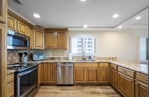 New Smyrna Beach Condo | Renovated direct oceanfront corner condo with a huge wrap-around balcony and pool