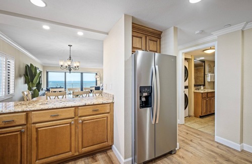 New Smyrna Beach Condo | Renovated direct oceanfront corner condo with a huge wrap-around balcony and pool