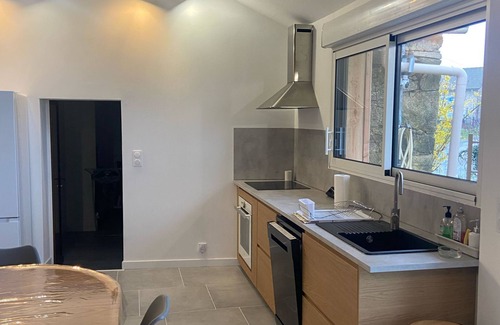 Nexon House | Renovated old house with large living room.