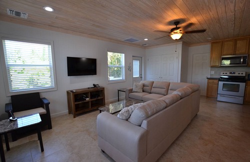 Spanish Wells House | Rental Cottage with DOCK on the canal in Pelican Bay