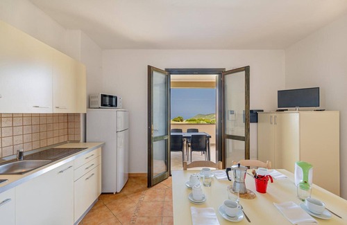 Tergu Apartment | Residenza Le Farfalle 'A' with Garden View, Wi-Fi and Air Conditioning