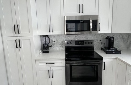 Garden Isles House | Resort 561-Saltwater heated pool & spa.