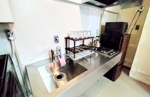 Yokosuka House | Retro Romantic Room! Private rooftop room with a view of Tokyo Bay beyond the Uraga Dock.