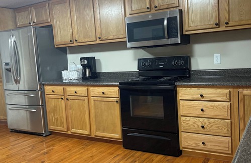 Covel House | Ride to the trails! Comfortable 5 bedroom house, large parking area!
