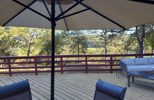 Cherokee Village House | RIR: E Faye Jones style Rock floor to ceiling in 3 bathrooms open floor plan.