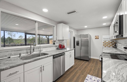 Forest Hills House | River House with heated Pool, Sunsets, Fishing, Dolphin & Manatee Watching