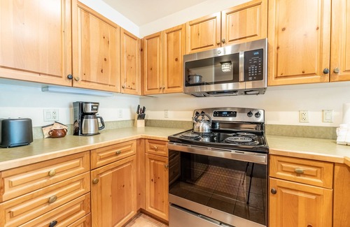 River Run Condo | River Run Condo with Spacial Balcony overlooking Ice Rink & Mountain Views!
