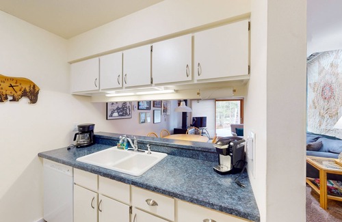 Glen Arbor Condo | River-view condo with fireplace, deck, washer/dryer, and community firepit