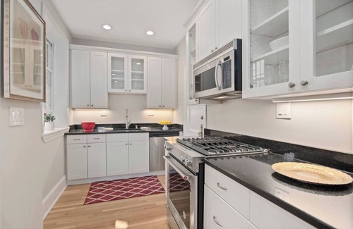 West Cambridge Condo | River Views Harvard Square 2BR with Cozy Fireplace