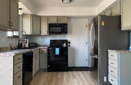Milford House | Riverfront home in village—walk downtown—park and hike/bike trails—kayaks.