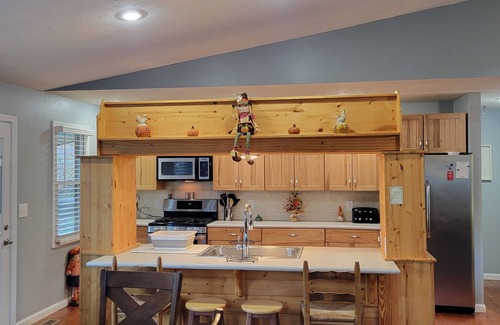 Cosby Cabin | Riverfront cabin near the Smoky Mountains with a hot tub.