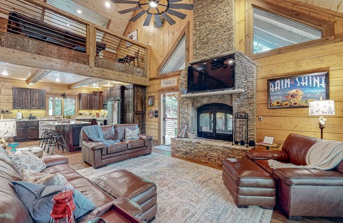 Ellijay House | Riverfront dog-friendly cabin with pool, double-sided fireplace, & firepit