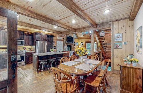 Ellijay House | Riverfront dog-friendly cabin with pool, double-sided fireplace, & firepit