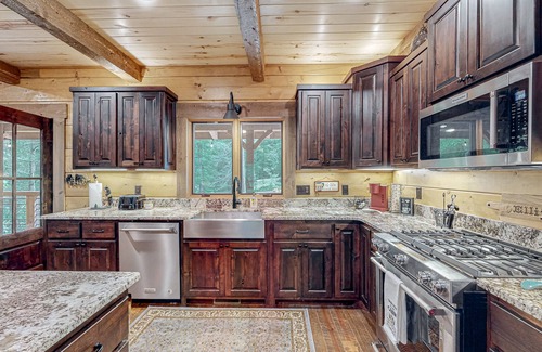 Ellijay House | Riverfront dog-friendly cabin with pool, double-sided fireplace, & firepit