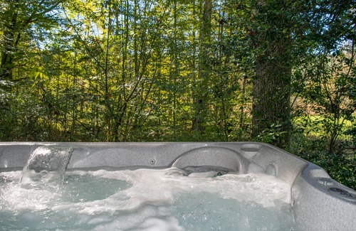 Elkins House | Riverfront luxury in the woods - main level master bedroom