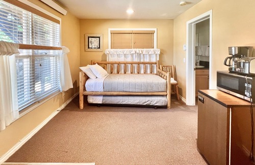 Grand Lake Condo | Riverfront retreat with a kitchenette, washer/dryer, & shared patio