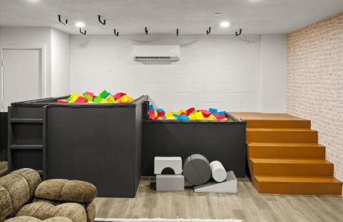 Cactus Meadows House | Rock Climbing Wall Pool& Mini Golf Game Room Mural