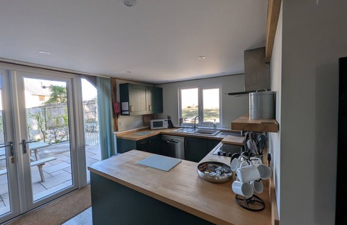 Holworth Cottage | ROMAN LODGE, pet friendly, with a garden in Osmington