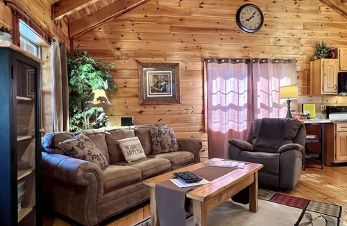 Gatlinburg - Pigeon Forge Cabin | Romantic Cabin - Fishing Pond-King Bed-Double Sided Fireplace-HotTub-Screen Deck
