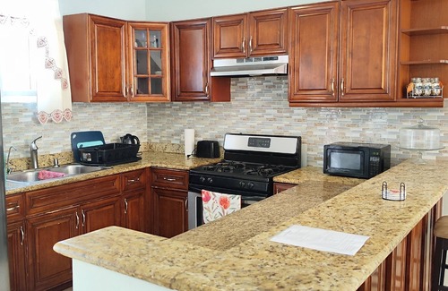 Coral Harbour House | Romantic Getaways or Family fun. Enjoy Island Vibes at 2BR Townhome Near Beach!