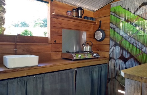 Busserolles Cabin | Romantic riverfront shepherds' hut with outdoor kitchen w/firepit